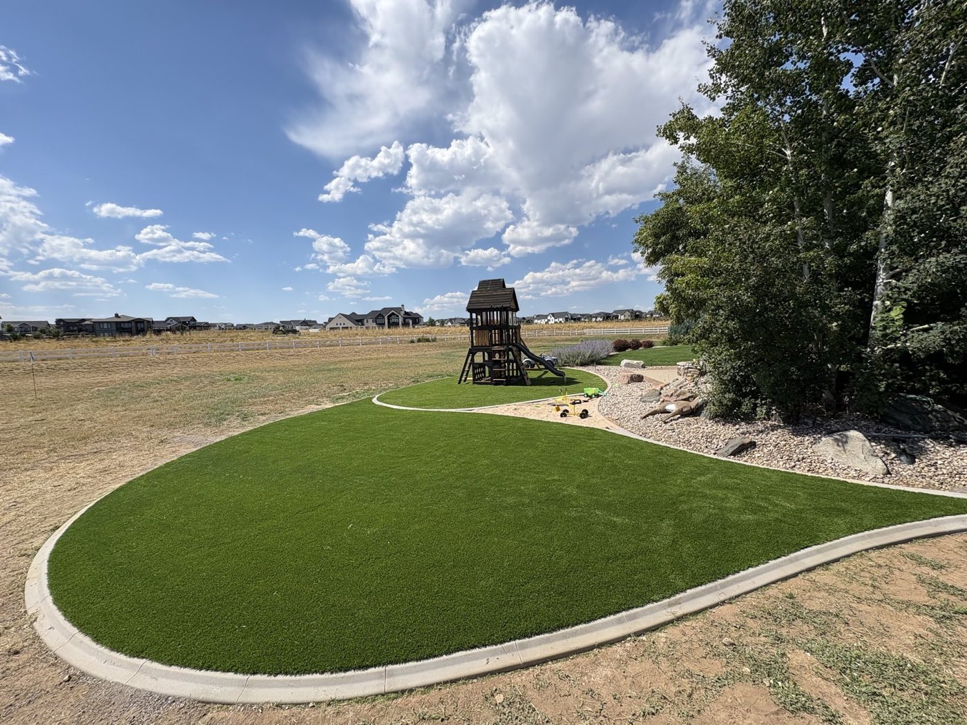 Artificial lawn with a children's playset