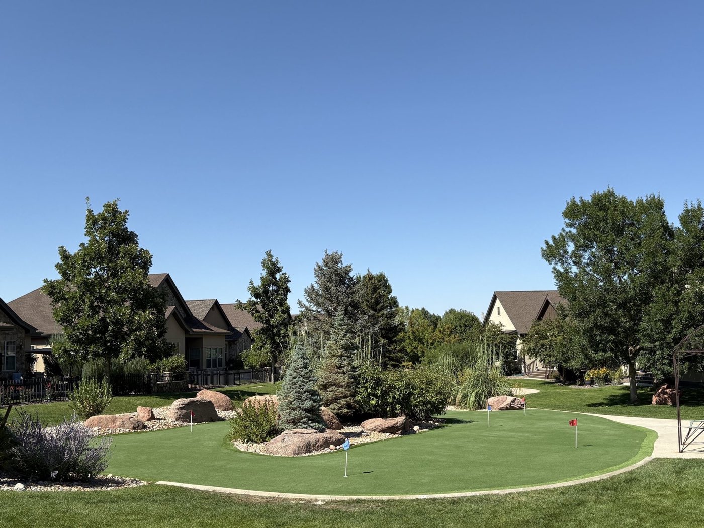 Backyard putting green viewed from the street